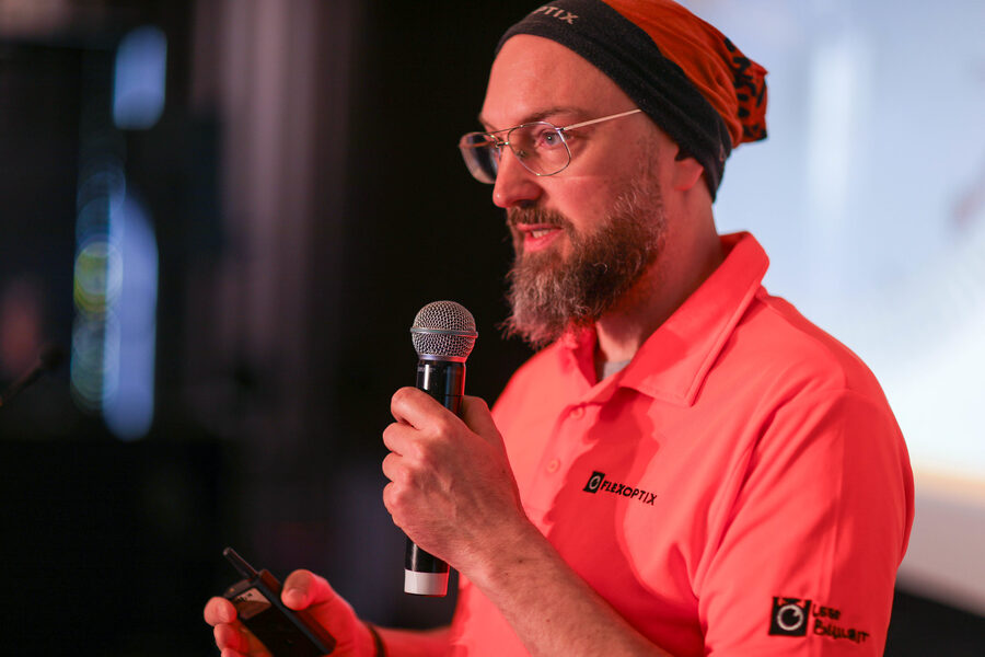 Speaker taking questions at a ZANOG event